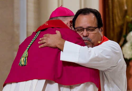 Archbishop Thomas Wenski, left, and Lutheran Bishop-elect Pedro Suarez embrace during the Common Prayer service for Reformation 500 at St. Mary Cathedral.