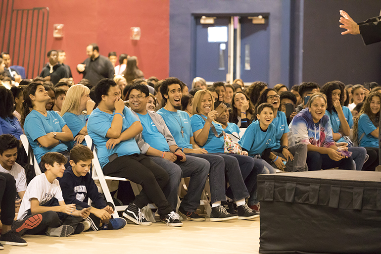 Students react to keynote speaker Father Tony Ricard, pastor of St. Gabriel the Archangel and campus minister/theology teacher at St. Augustine High School in the Archdiocese of New Orleans. Approximately 700 teenagers attended Mercy Night 2017 at St. Thomas University in Miami Gardens.