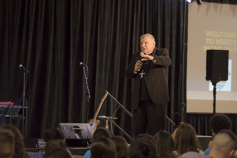 Archbishop Thomas Wenski speaks to the hundreds of youths attending the 2017 Mercy Night. The celebration took place at St. Thomas University in Miami Gardens.