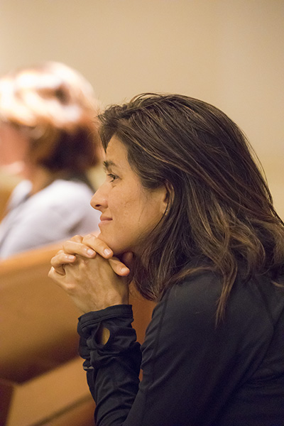 Claudia Ferer, parishioner at Bonaventure Church in Davie, listens to Immaculee Ilibagiza tell her story of survival during the Rwandan genocide. She survived hidden for 91 days with seven other women in a small bathroom, no larger than 3 feet by 4 feet.