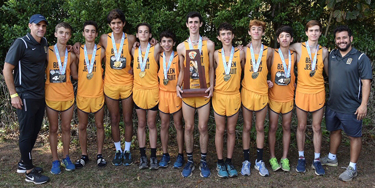 Belen Jesuit's cross country runners pose with their coaches after winning their ninth overall state title.