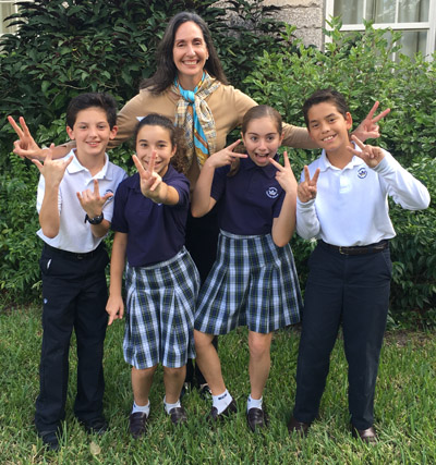 Let's hear it for the spelling champs: Fifth graders Luis Lasa, Sophia Rodriguez, Lea Archambault, and Diego Tejera-Avila accompanied by their spelling coach Lucia Salas.