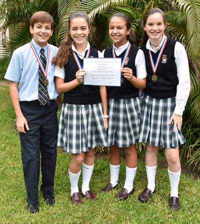 Epiphany eighth graders who produced a gold medal-winning news package on Miami-Dade Animal Services pose with their awards. The team also won first place at the Florida Scholastic Press Association Fall Workshop.