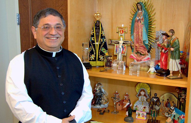 Bishop-elect Enrique Delgado likes to collect mementoes from mission trips he's led abroad.