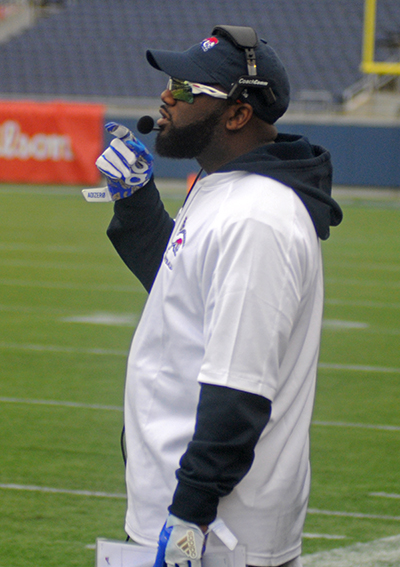 Chaminade-Madonna coach Dameon Jones observes his team during the first half in Chaminade-Madonna's 31-28 victory over the West Palm Beach Oxbridge Academy ThunderWolves in the Class 3A FHSAA Football Final Dec. 9 at Camping World Stadium in Orlando. The Lions won their third state championship in school history.