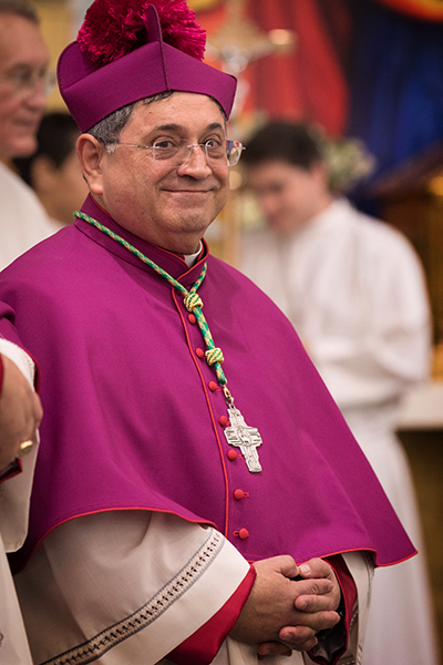 Bishop-elect Enrique Delgado takes in the applause at St. Katharine Drexel Parish in Weston during solemn vespers on the eve of his ordination as the newest auxiliary bishop of the Archdiocese of Miami.