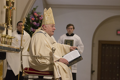 Archbishop Thomas Wenski preaches the homily at the start of the ordination rite for six new permanent deacons for Miami.