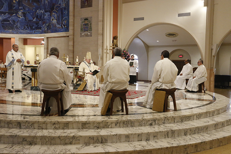 Archbishop Thomas Wenski preaches the homily at the start of the ordination rite for six new permanent deacons for Miami.