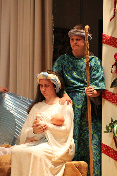Marian Center students depict Mary and Joseph welcoming their newborn Jesus.