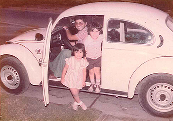 The future Bishop Enrique Delgado poses with his younger brother and a niece in his native Peru.