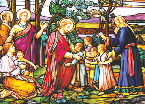 This stained glass window depics Jesus' call to receive the Kingdom of God "like children", and to preserve and defend every child's right to life.