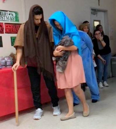 Two Puerto Rican students portray Mary and Joseph during a pageant at St. Thomas University.
