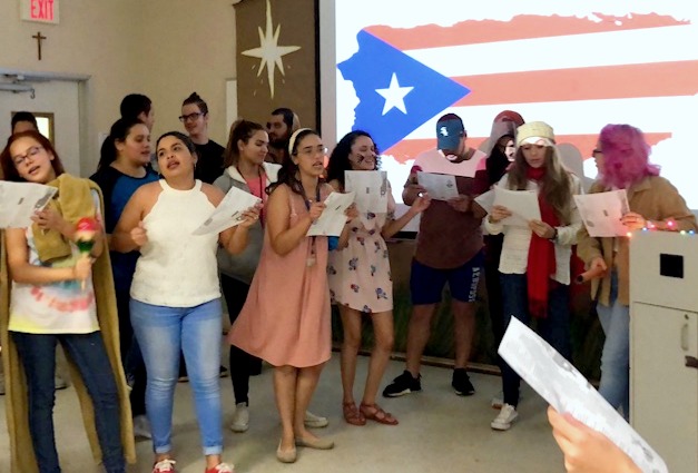 Puerto Rican students sing about their homeland during a presentation at St. Thomas University.