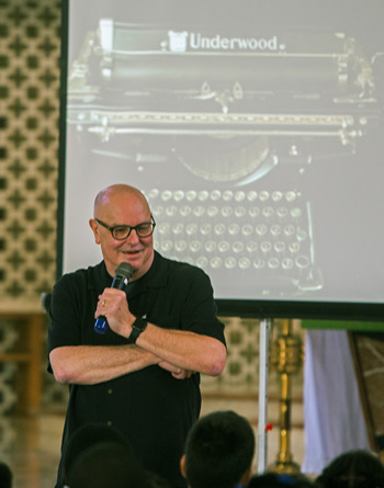 Children's book author Roland Smith talks about the Underwood typewriter that he received for Christmas at 5 years old, during talks to children from St. Mary, St. James, St. Lawrence and Holy Family Schools.