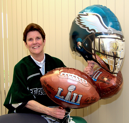 Sister Margaret Fagan floats Philadelphia Eagles-themed balloons in her office at Epiphany School, Miami.