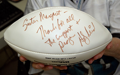 Sister Margaret Fagan holds a football autographed by former head coach Andy Reid of the Philadelphia Eagles. She tried unsuccessfully to get the team to attend a pep rally at Epiphany School in 2011; Reid sent his regrets plus the football.