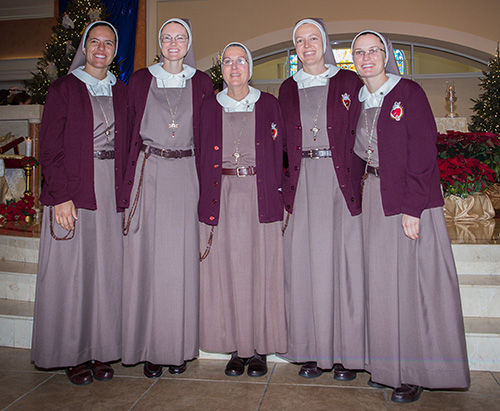 The newly professed sisters pose with their superior, Mother Adela Galindo, center, foundress of the Servants of the Pierced Hearts of Jesus and Mary, after the ceremony. From left: Sister Alexia Maria Zaldivar-Boillat, Sister Brittany Rose Samuelson, Sister Mary Rachel Hart, and Sister Clare Marie Bailey.