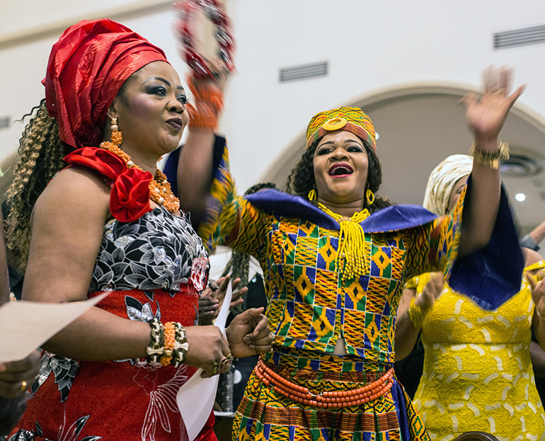 Stella Madu and Adama Osuji sing a traditional Nigerian song after Mass.