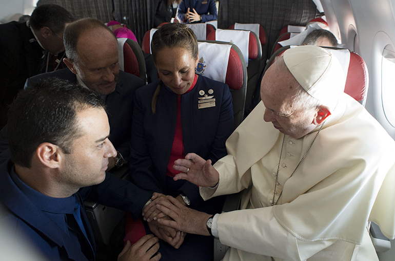 Pope Francis marries flight attendants Paula Podesta and Carlos Ciuffardi during his flight from Santiago to Iquique Jan. 18, 2018.