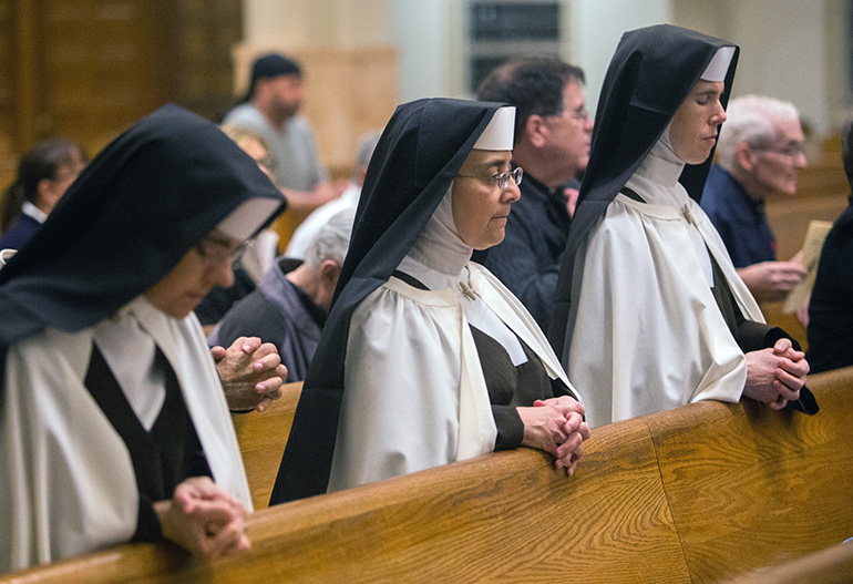 Carmelite Sisters of the Most Sacred Heart pray during the Mass marking the World Day of Consecrated Life. The Mass took place Jan. 20 at St. Mary Cathedral.