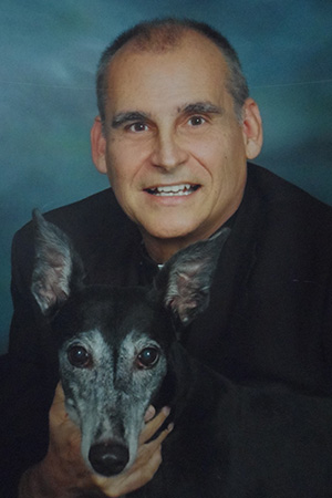 Father Oscar Sarmiento: Born Nov. 8, 1940, ordained Nov. 27, 1982, died Jan. 6, 2018. He is pictured here with his pet, a retired greyhound named Lady.