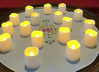 Seventeen candles -- one for each of those killed during the mass shooting at Marjory Stoneman Douglas School -- are placed before the altar at St. Jerome Church.