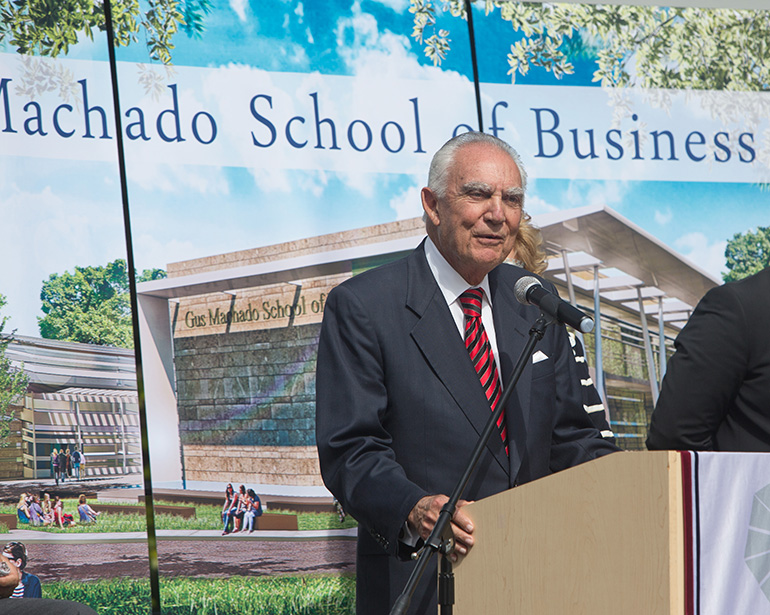 Businessman and philanthropist Gus Machado addresses the audience Jan. 24 at the groundbreaking for the new School of Business buildings at St. Thomas University. The school and building complex will be named in his honor.