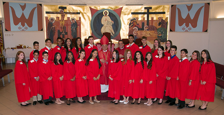 Mother of Christ School's 2018 confirmation class pose with Auxiliary Bishop Enrique Delgado and Father Jorge Carvajal after the two presided at their first confirmation since their new appointments. Bishop Delgado as bishop and Father Carvajal as parish administrator.