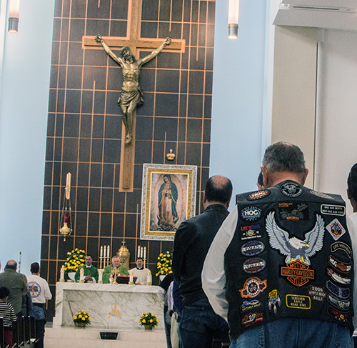 Archbishop Thomas Wenski celebrates Mass before leading dozens of motorcyclists on a ride from Our Lady of Guadalupe Church, Doral, to Peterson's Harley-Davidson in Northwest Dade. The annual ride raises funds for Catholic Charities' St. Luke's Center, a rehabilitation facility for those addicted to drugs and alcohol.