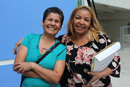 Martina Guillen, right, poses with her godmother Claudia Garzon. Guillen, who is originally from the Dominican Republic, was convinced by her godmother, a native of Colombia who became a U.S. citizen years ago. The two saw a commercial for the New Americans Campaign Mega Citizenship Workshop and knew it was time for action.