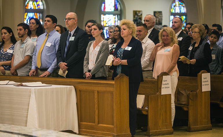 Catechumens, flanked by their sponsors, fill the pews of St. Mary Cathedral during the first of two Rite of Election ceremonies held Feb. 18, the Sunday after Ash Wednesday.