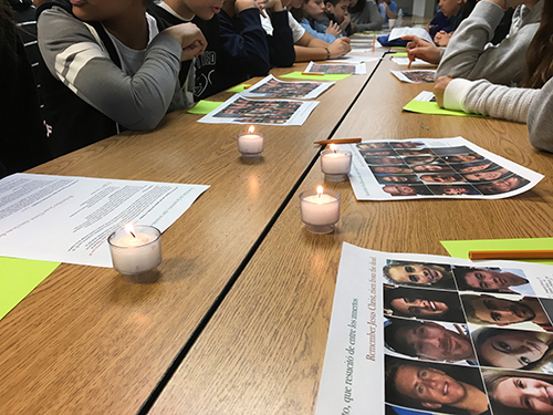 Students in the religious education programs of Our Lady of Guadalupe Church in Doral lit candles and looked at pictures of the Parkland shooting victims as they prayed for them.
