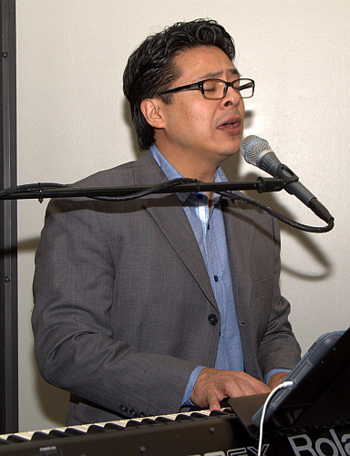 Tadeo Castro plays keyboard before giving the message at Mary Help of Christians Church, Parkland, during a prayer service for victims of the Feb. 14 shooting at a nearby school.