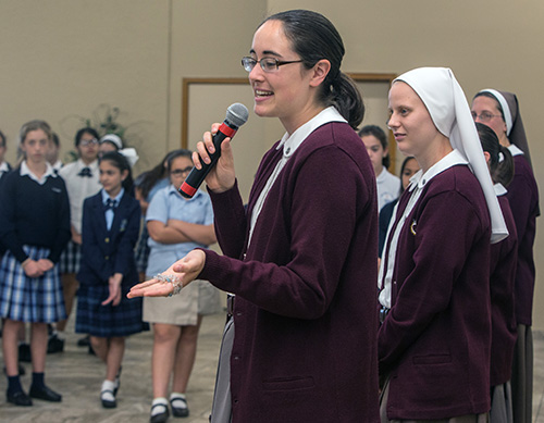 Karolyn Shewchuk, a postulant with the Servants of the Pierced Hearts of Jesus and Mary, speaks to sixth grade girls about being a postulant, novice and then sister during the Focus 11 vocations rally March 1 at St. Agatha Church, Miami.