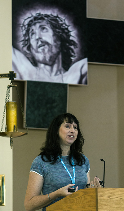 Rosemarie Banich, archdiocesan director of Youth and Young Adult Ministry, speaks to more than 200 participants in the Archdiocese of Miami Youth Ministry Summit.