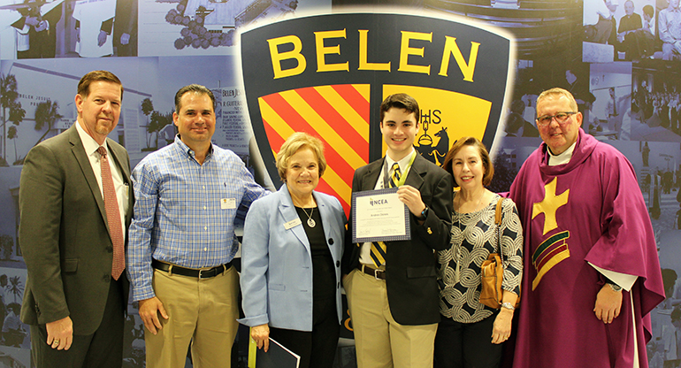 Belen Jesuit Prep senior Andres Dones receives the 2018 Youth Virtues, Valor and Vision Award during the Ignatian Week Mass at the Miami high school. The award was presented by Heather Gossart, third from left, of the National Catholic Education Association. Also in the photo, from left: Belen Principal Jose Roca, Andres' father, Jorge Dones, his grandmother, and Belen's president, Jesuit Father Guillermo Garcia-Tuñon.