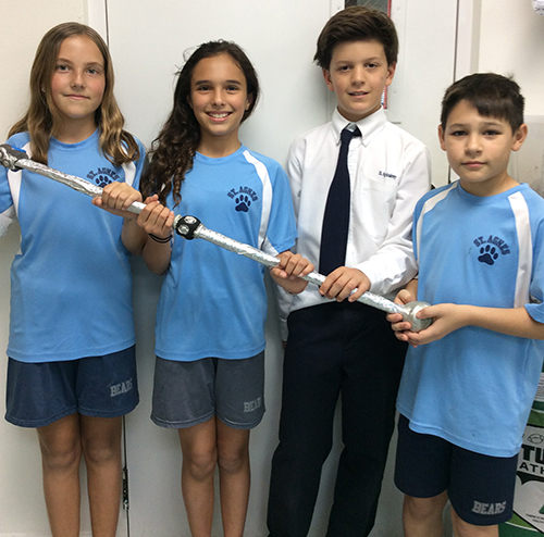 St. Agnes Academy fifth-graders and ExploraVision regional winners, from left, Maria Ruiz Verjano, Sofia Aleman, Theo Waterhouse, and Federico Calzadilla with their Smart Staff project "to help blind people walk safely."