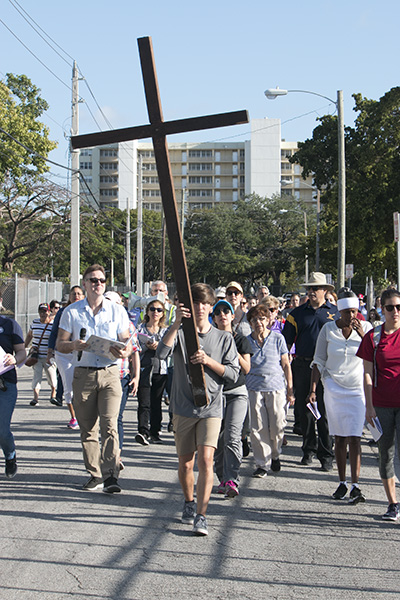 Led by Belen sophomore Julian De la Maza, Way of the Cross participants walk to the second station at the Linda Ray Intervention Center, which serves infants born addicted to cocaine.