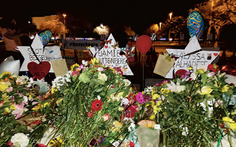 Flowers pile up outside Marjory Stoneman Douglas High School in Parkland in memory of the victims of the Feb. 14 shooting.