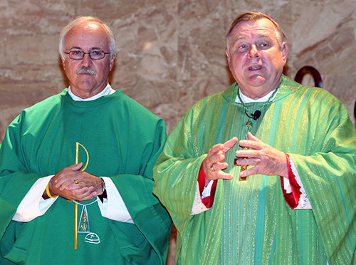 Deacon Richard Turcotte, left, Catholic Charities' chief executive officer since 1998, assists at the agency's 80th anniversary Mass in 2011. The Mass was celebrated by Archbishop Thomas Wenski, who served as Catholic Charities CEO from 1995 to 1998.
