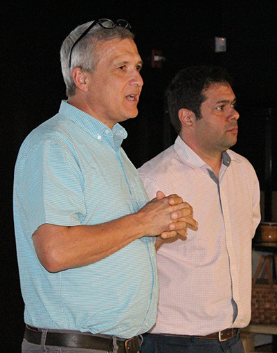 Carl Wilkens, left, stands with Immaculata-La Salle English and political science teacher JC Moya at the beginning of the presentation on the 1994 genocide in Rwanda.