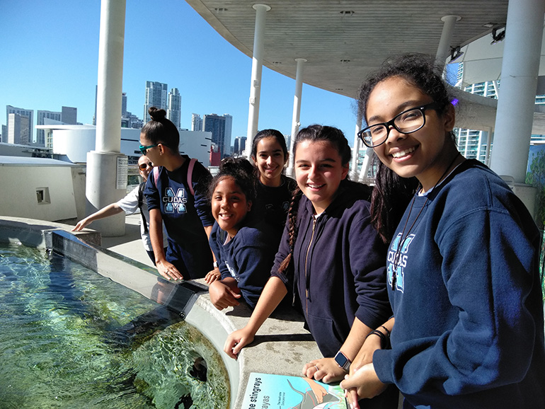 Members of Mother of Our Redeemer's seventh grade class enjoy their very hands-on visit to the Frost Museum in downtown Miami.