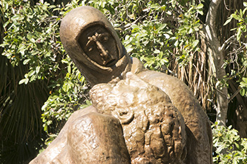 View of the Pieta after it was cleaned and most of the patina rubbed onto it. Workers would need scaffolding to get deeper into the faces of the image.