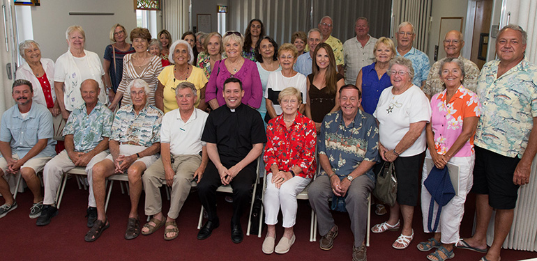 Father Richard Vigoa poses with the group from St. Peter, Big Pine Key, who took part in his training for Extraordinary Ministers of Holy Communion. In addition to serving as Archbishop Thomas Wenski's priest-secretary and master of ceremonies, Father Vigoa directs the archdiocesan Office of Worship.