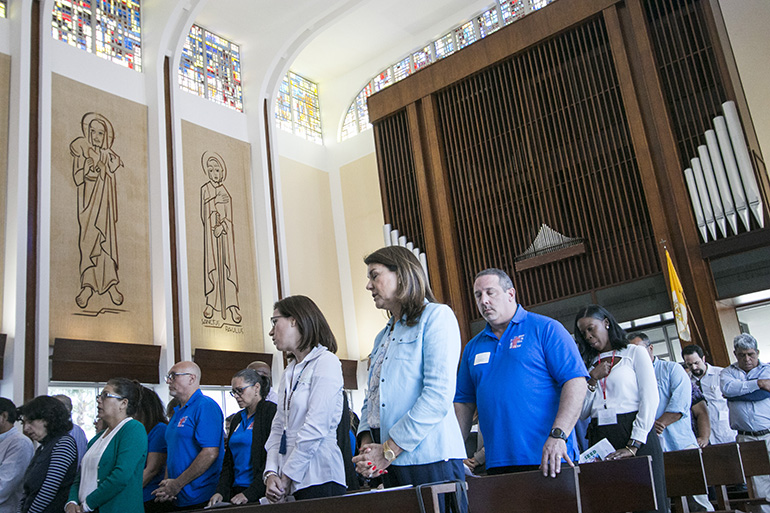 More than 150 representatives from dozens of parishes gathered at St. John Vianney College Seminary April 14, 2018, for Planting the Seeds, the first archdiocesan stewardship conference, sponsored by the Development Office. Here they pray during the Mass celebrated by Archbishop Thomas Wenski.