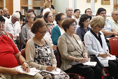 Participants at Planting the Seed listen to the presentation by Father Juan Carlos Paguaga, pastor of St. Agnes, Key Biscayne.