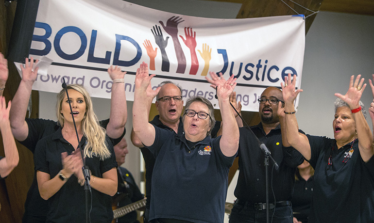 The Sunshine Cathedral choir performs at the beginning of BOLD Justice's 11th annual Nehemiah Action assembly, held April 23 at St. David Church in Davie.
