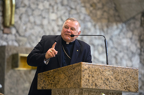 Archbishop Thomas Wenski addresses the congregation after delivering the opening prayer at BOLD Justice's 11th annual Nehemiah Action assembly, held April 23 at St. David Church in Davie.