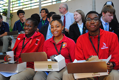 Msgr. Edward Pace High students, from left, Yamilee Constant, grade 11, Mikeiveka Sanon, grade 12, and Dimitrie Francois, grade 12, enjoy a Panera lunch courtesy of the Archdiocese of Miami in the atrium of the Pastoral Center.