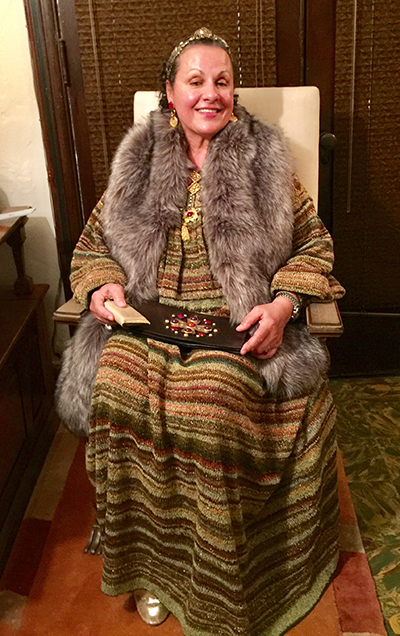 Veronika Guerra, of French and Moroccan heritage, sits in the presider’s chair used by St. John Paul II on his visit to Miami in 1987. She was taking part in the "Dessert With Father Davis" gathering at the Church of the Little Flower in Coral Gables.